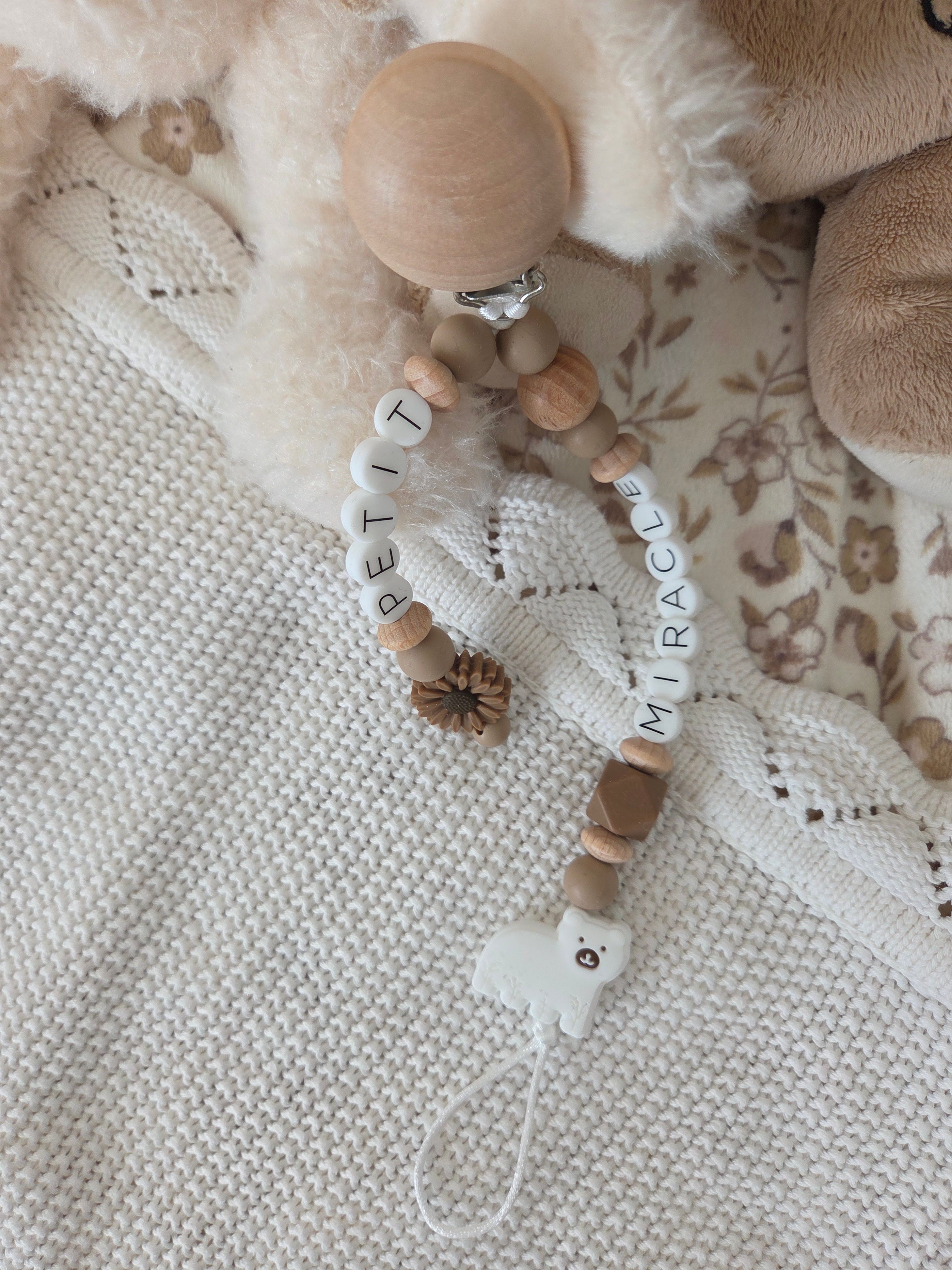 Attache-suce petit miracle ours blanc